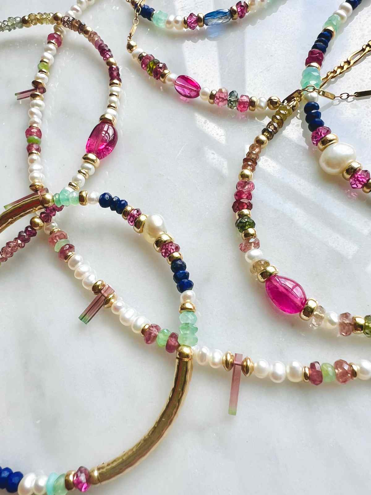 Image of vibrant gemstone and freshwater pearl necklaces and bracelets | Camille Jewelry